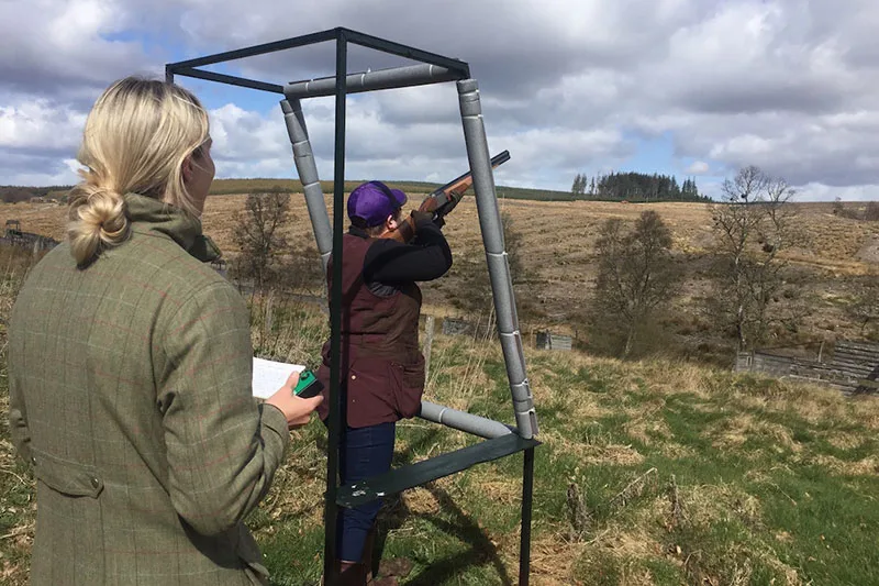 2 people enjoy a clay pigeon shoot.