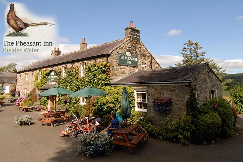 Country pub with outdoor tables.